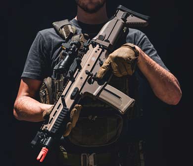Airsoft player holding a rifle